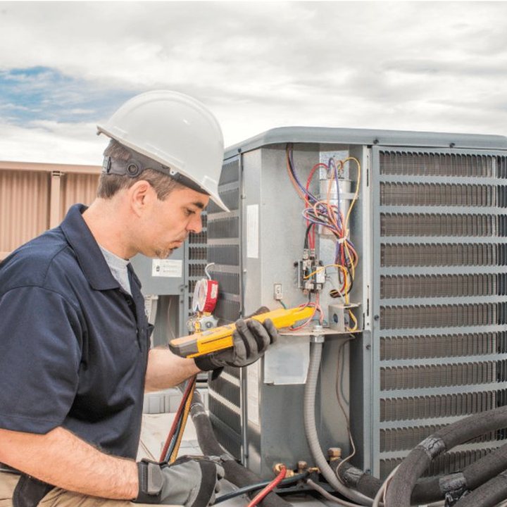 Dorchester Heating & Cooling HVAC technician on a service call in Dorchester, Ontario